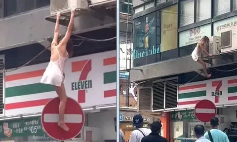 Sốc: Cô gái mặc váy ngắn liều mình đu người qua cửa sổ nhà cao tầng trốn cảnh sát